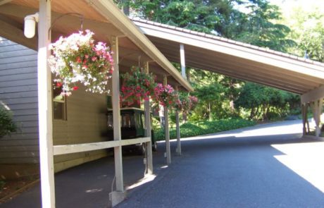 Hanging baskets of flowers outside Inn at Otter Crest