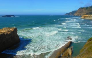 A standing viewpoint from a cliff at Otter Crest State Park, near The Inn at Otter Crest.