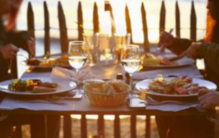 A group of four plates can be seen at some of the best restaurants on the Central Oregon Coast, at sunset.